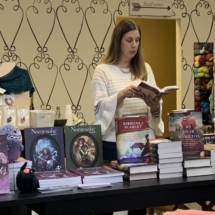 Laura at a reading salon